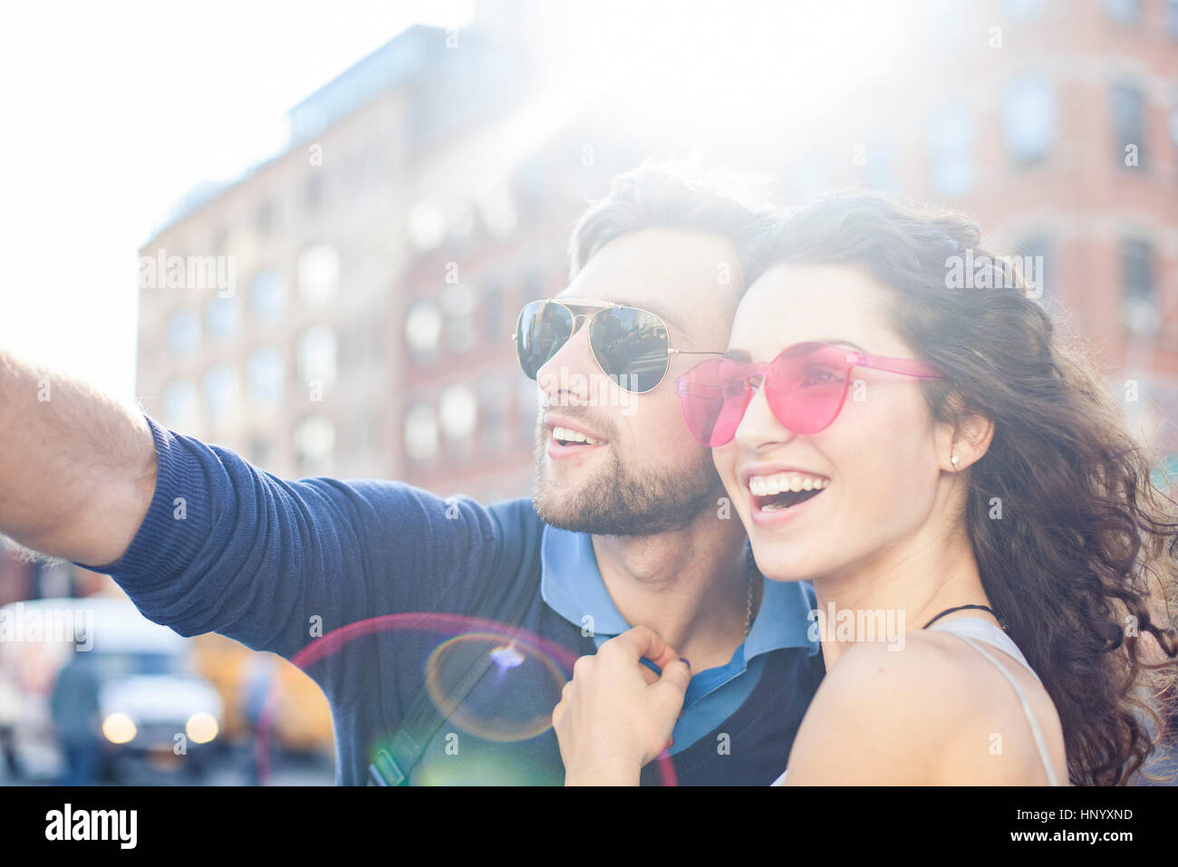 Couple sightseeing in city together Stock Photo