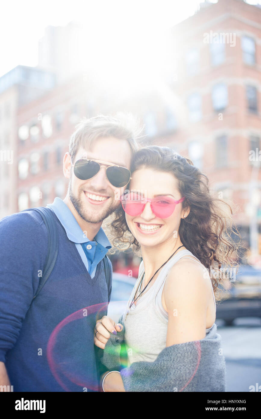 Couple standing together on city street, portrait Stock Photo