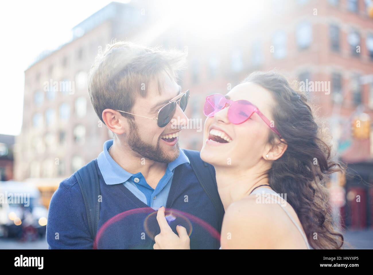 Couple laughing together outdoors Stock Photo