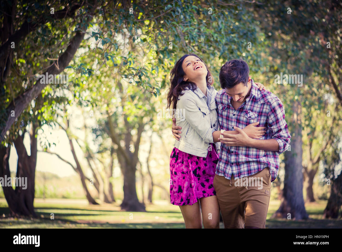 Couple enjoying walk in park Stock Photo - Alamy