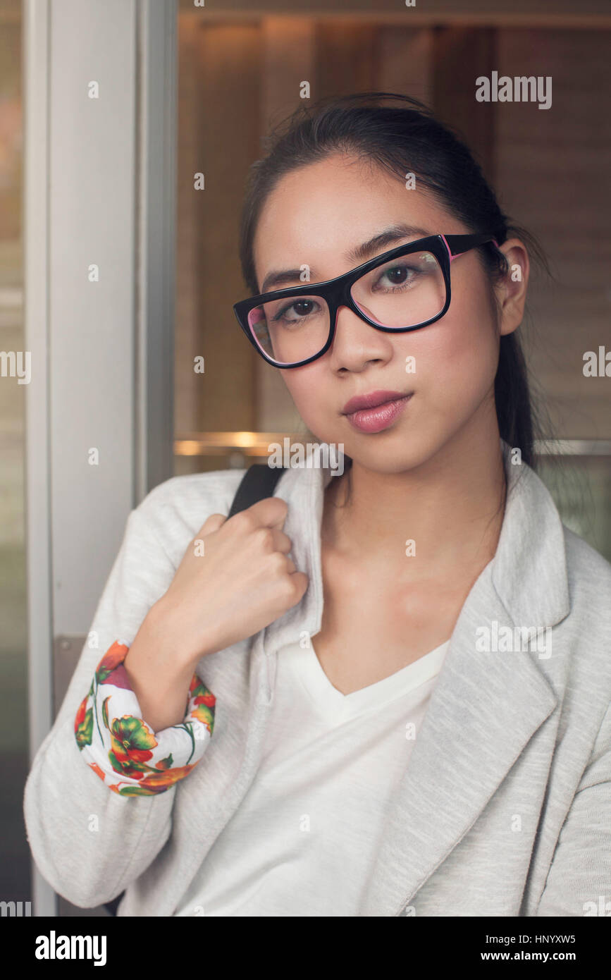 Young woman wearing glasses, portrait Stock Photo - Alamy