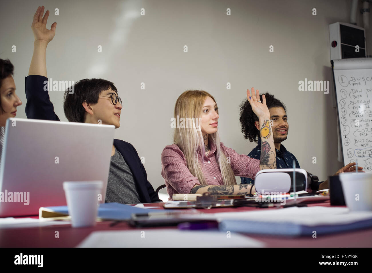 Office workers voting during business meeting Stock Photo Alamy