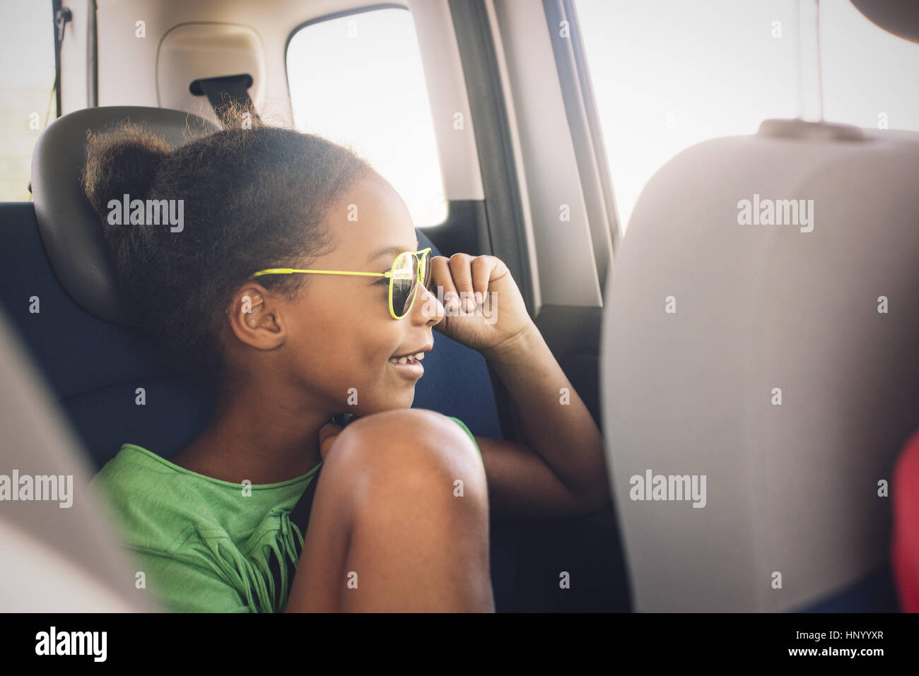 Girl looking out car window Stock Photo