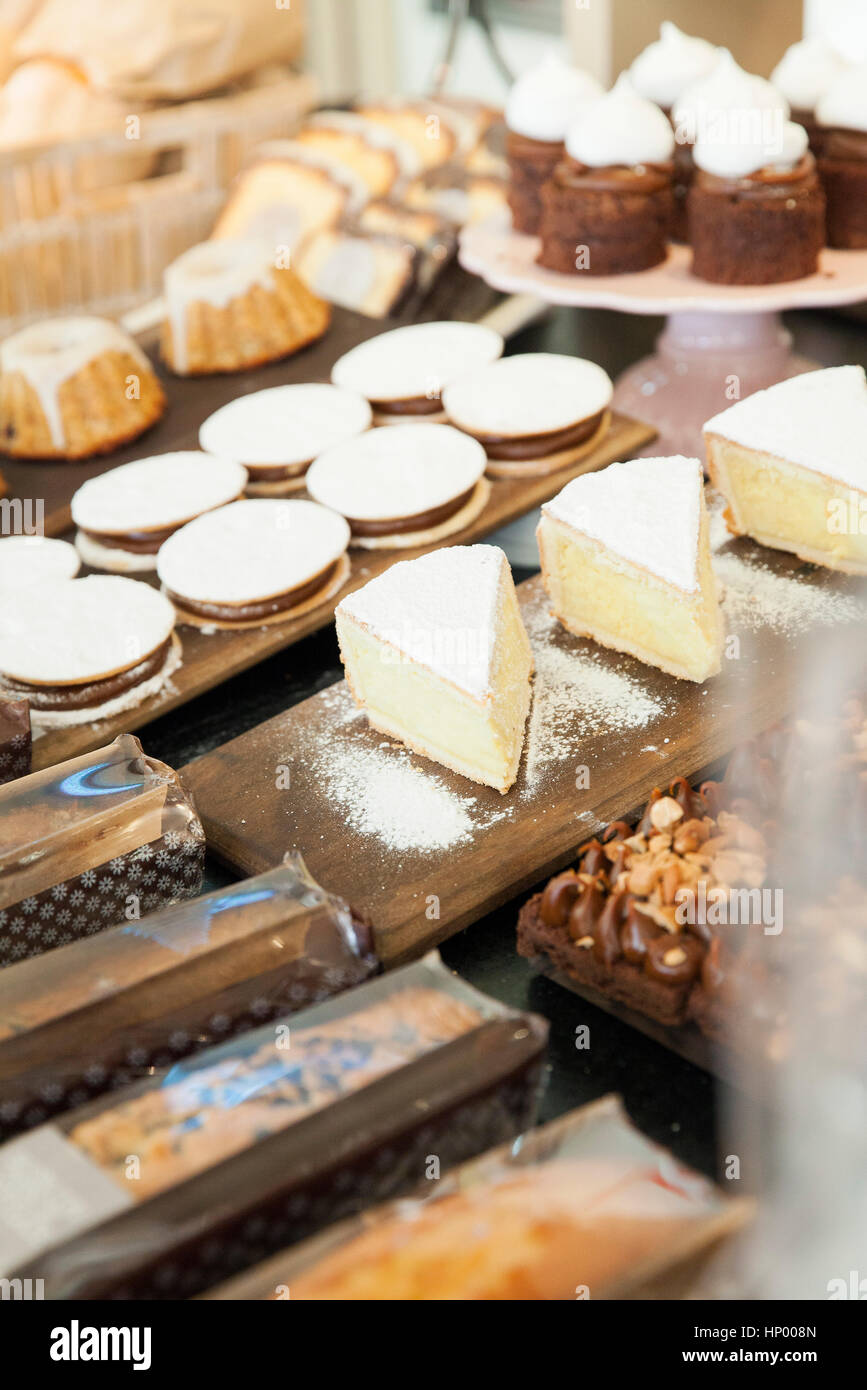 Desserts in bakery display Stock Photo Alamy