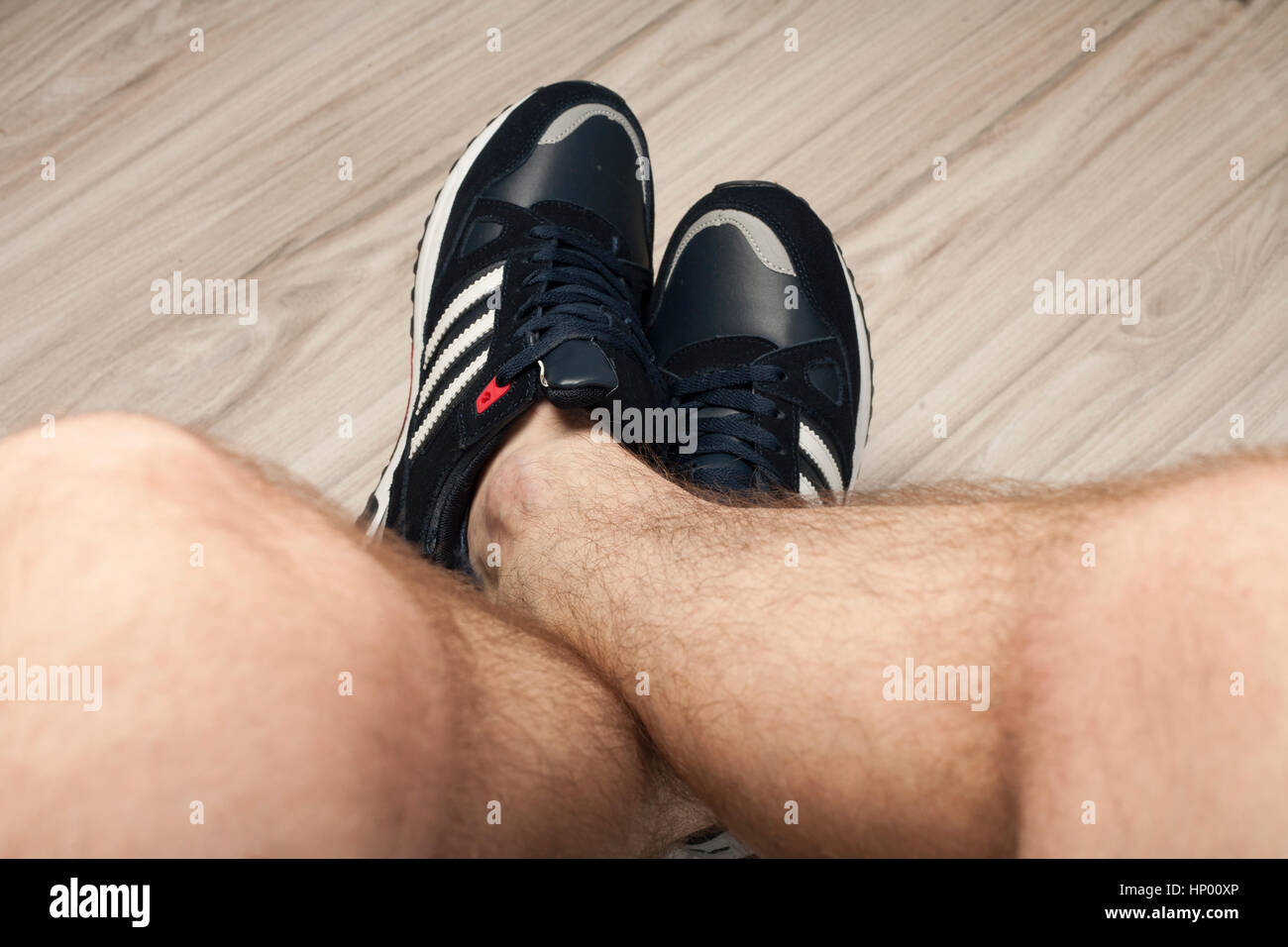 Man's hairy legs in sport shoes Stock Photo - Alamy
