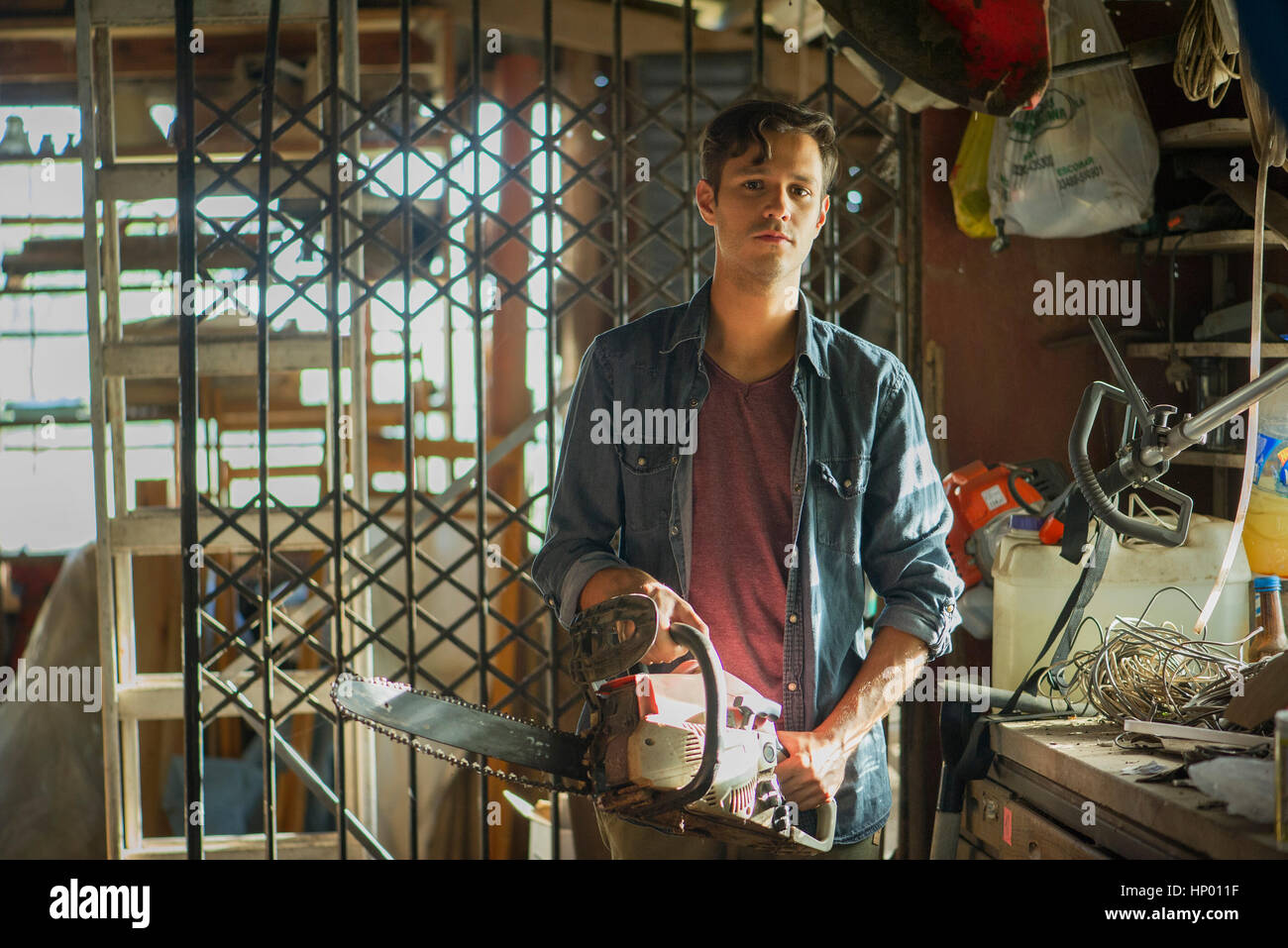 Man Holding Chainsaw High Resolution Stock Photography and Images - Alamy