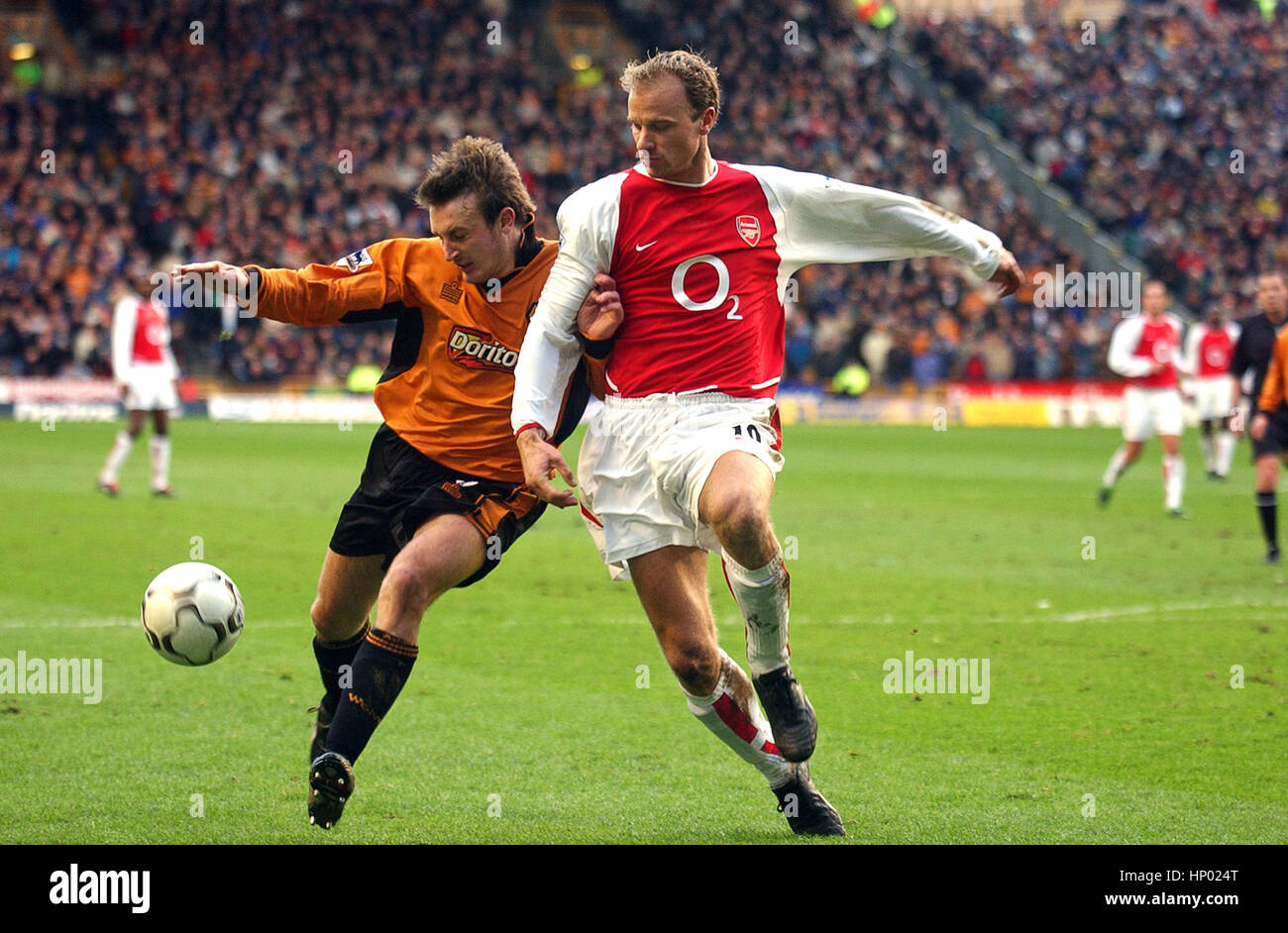 Lee Naylor and Dennis Bergkamp Wolverhampton Wanderers v Arsenal 2004 Stock Photo