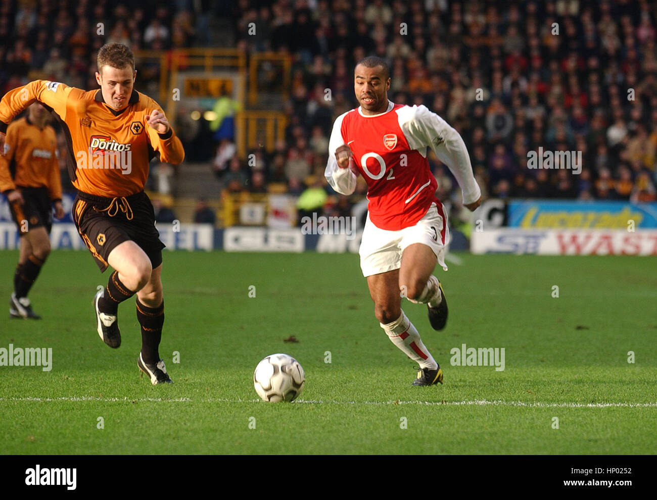 Kenny Miller and Ashley Cole Wolverhampton Wanderers v Arsenal 2004 Stock Photo