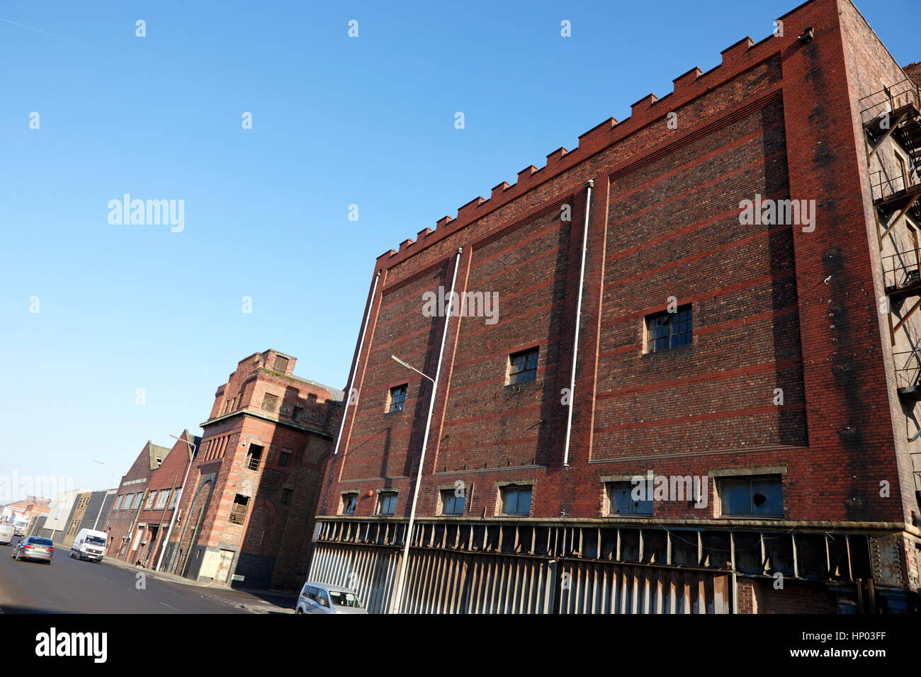 red brick former dockland buildings on regent road and brunswick place bootle liverpool uk Stock Photo