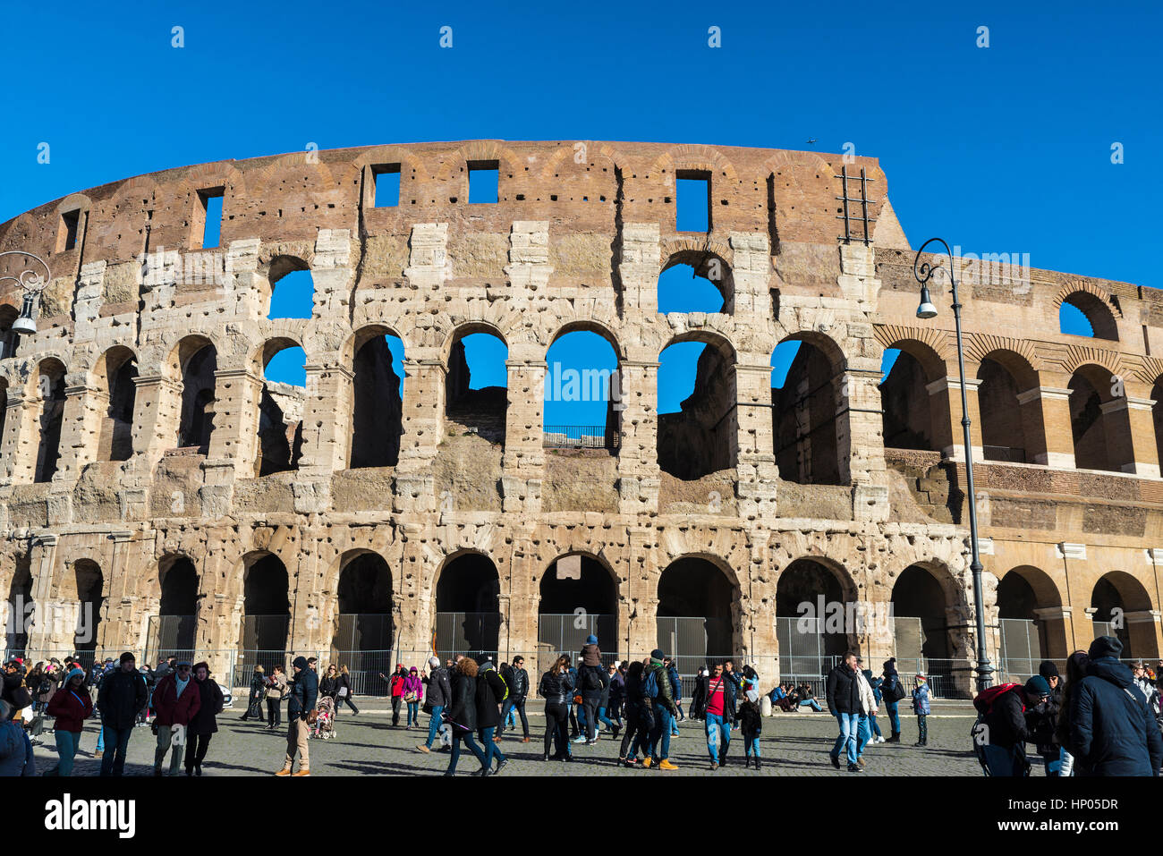 Rome, Italy - December 30, 2016: View of coliseum of Rome with tourists ...
