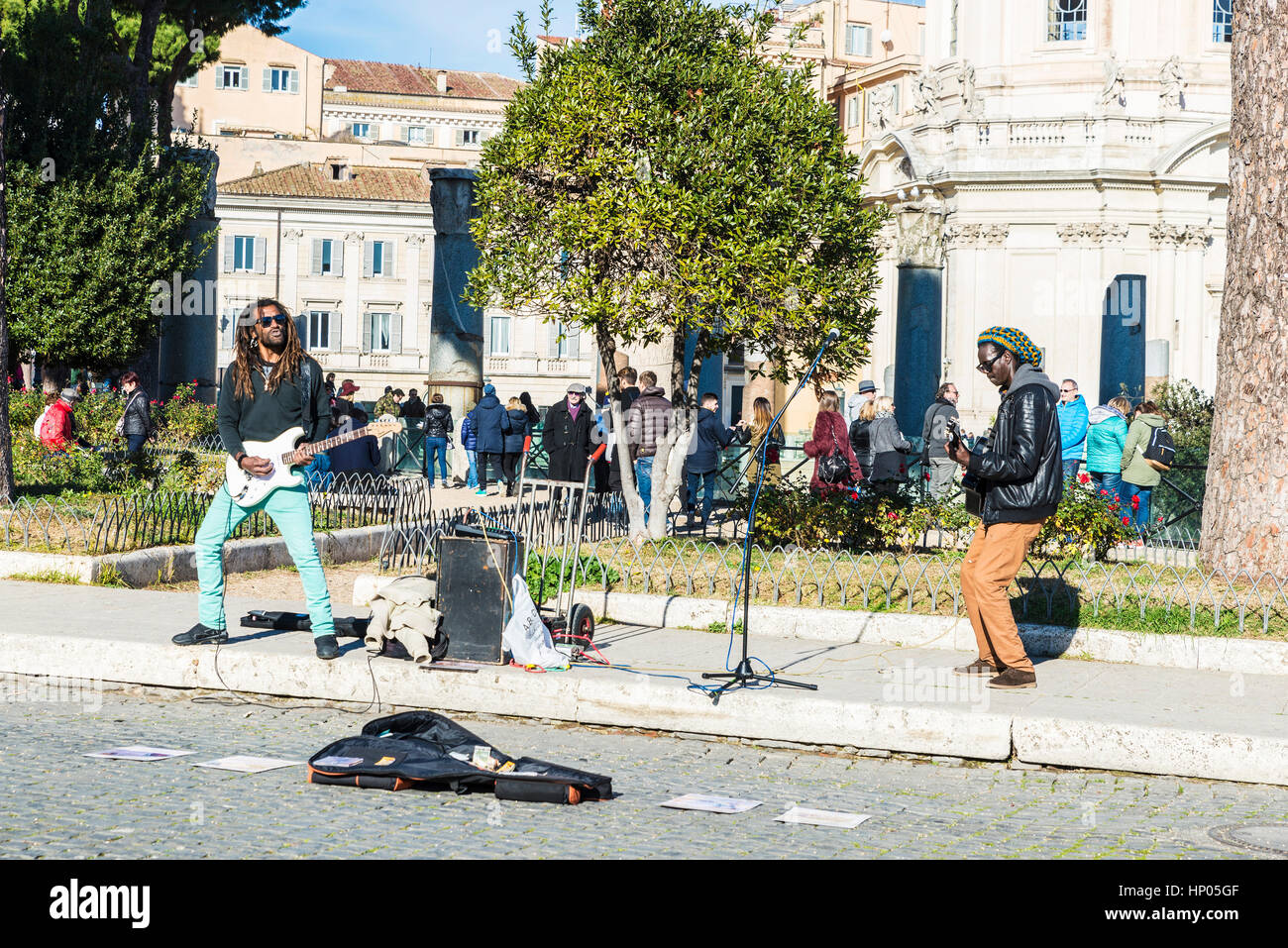 Rome, Italy - December 31, 2016: Two street musicians of rasta origin singing and playing electric guitar in the historical center of Rome Stock Photo