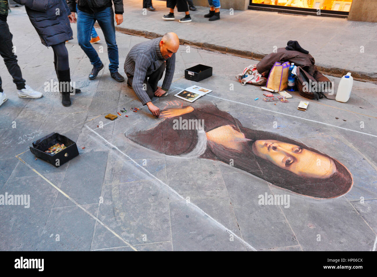Street artist painting picture of Mona Lisa in Florenze in Italy Stock Photo