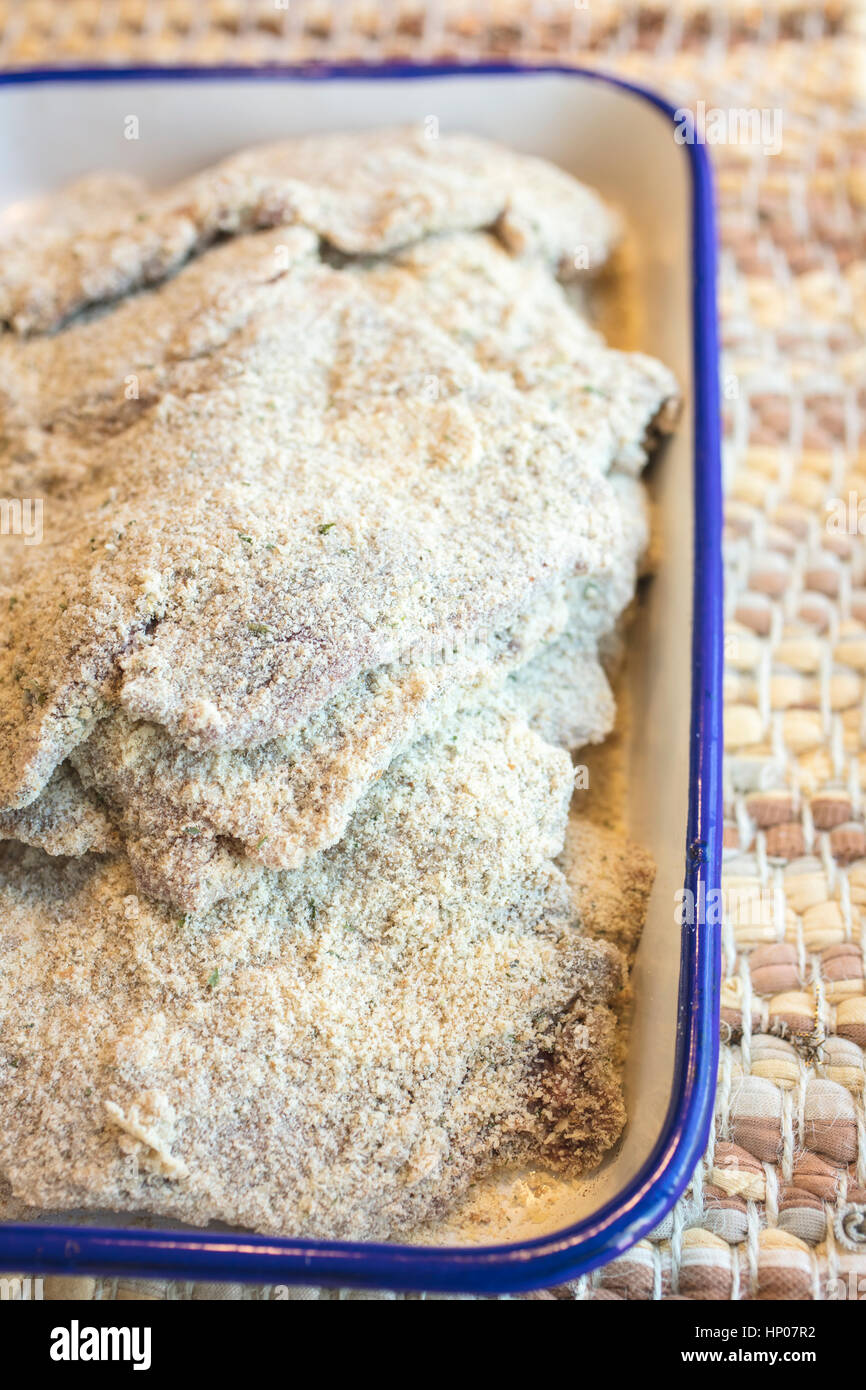 Breaded steaks ready to fry in oil for a dinner meal Stock Photo Alamy