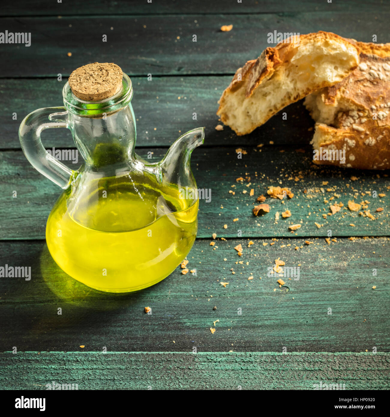 Olive oil pitcher and loaf of bread with copyspace Stock Photo Alamy