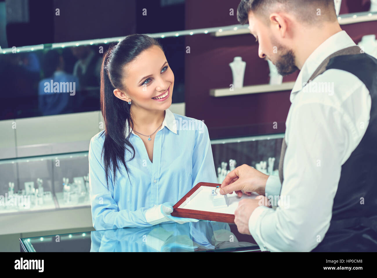 Handsome young man buying jewelry at the local jewelry store Stock Photo -  Alamy