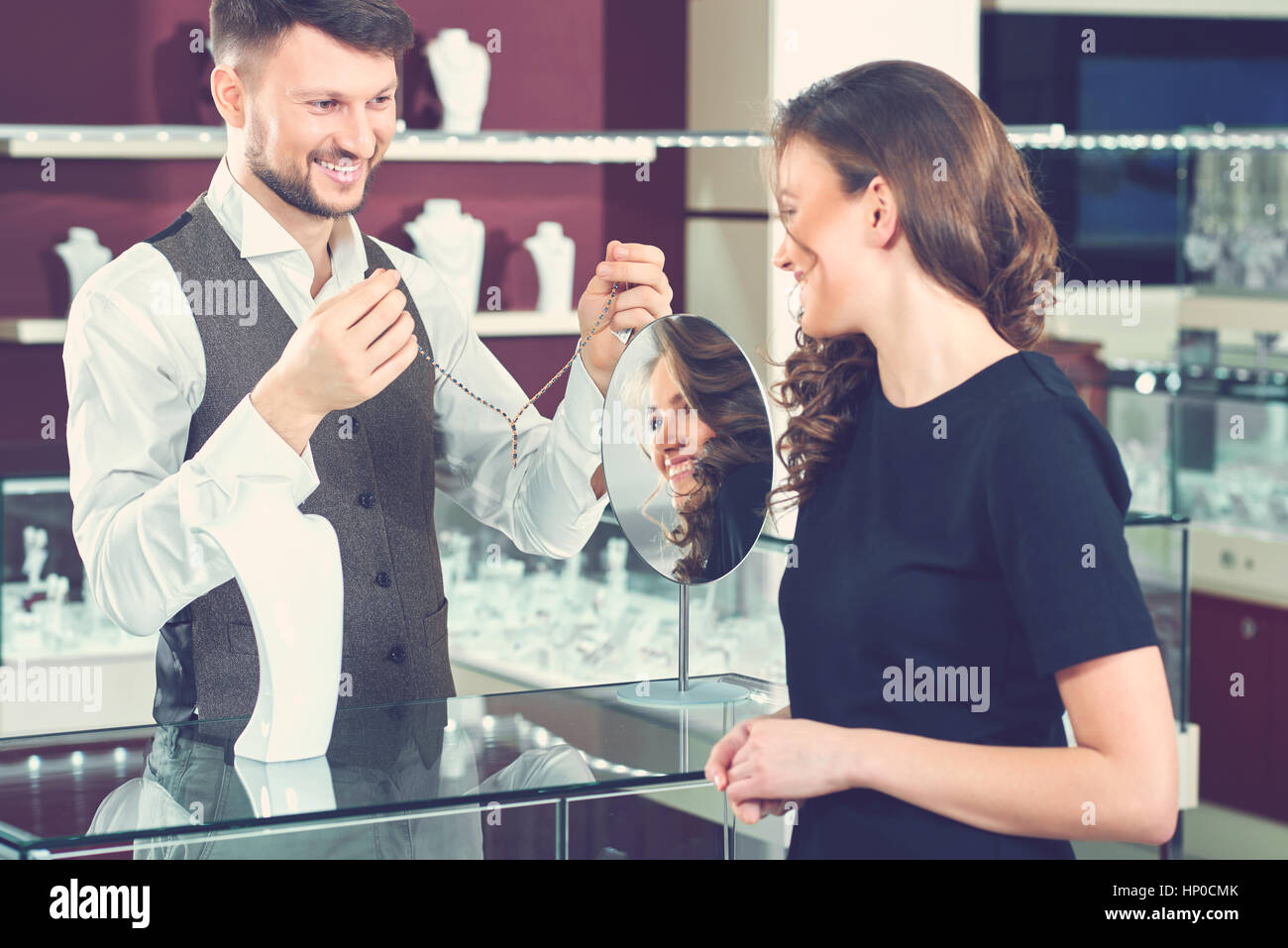 Professional male jeweler helping his female customer at the sto Stock Photo Alamy
