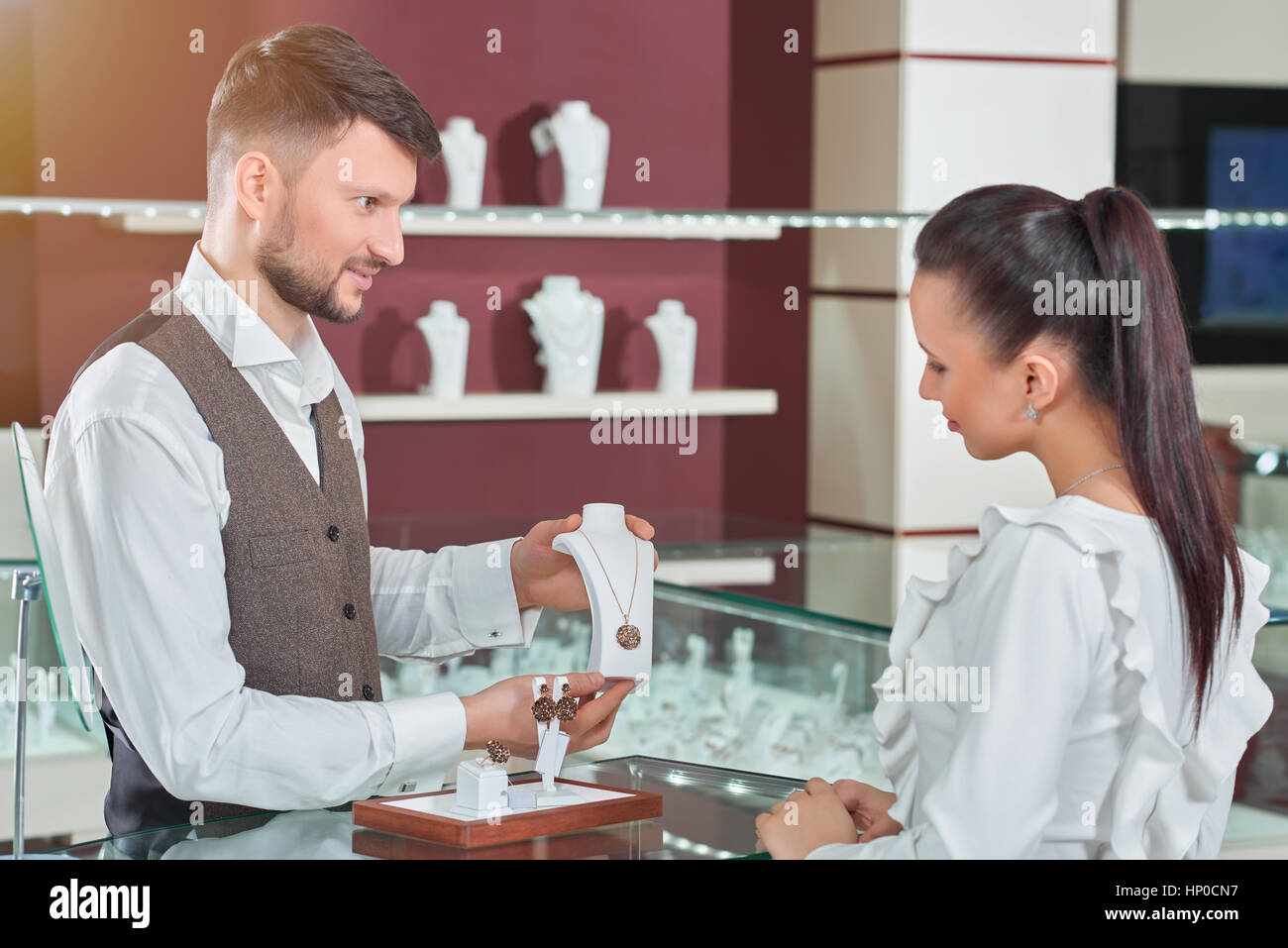 Professional male jeweler helping his female customer at the sto Stock Photo Alamy