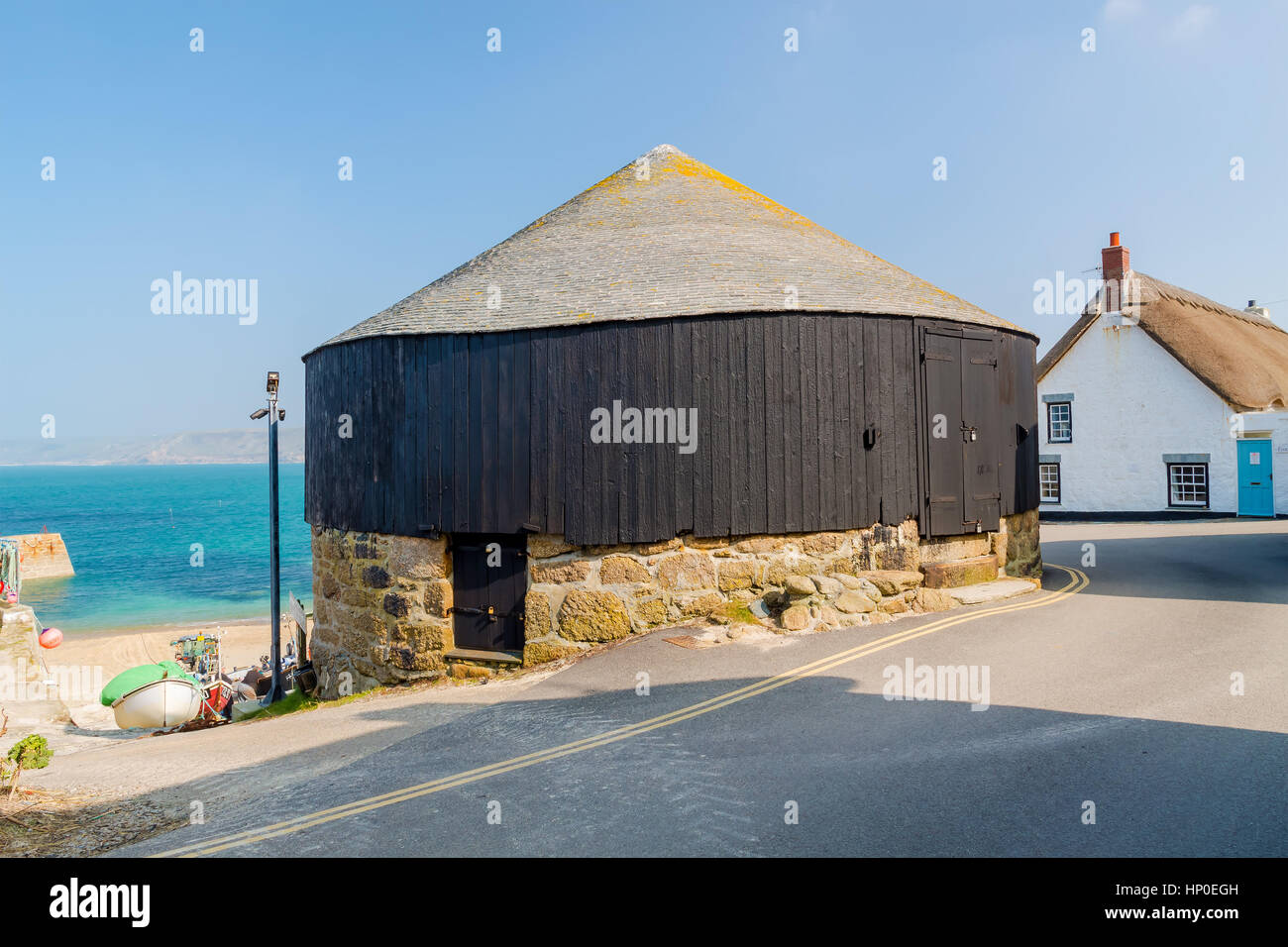 Traditional Round House next to the harbour at Sennen Cove Cornwall England UK Europe Stock Photo