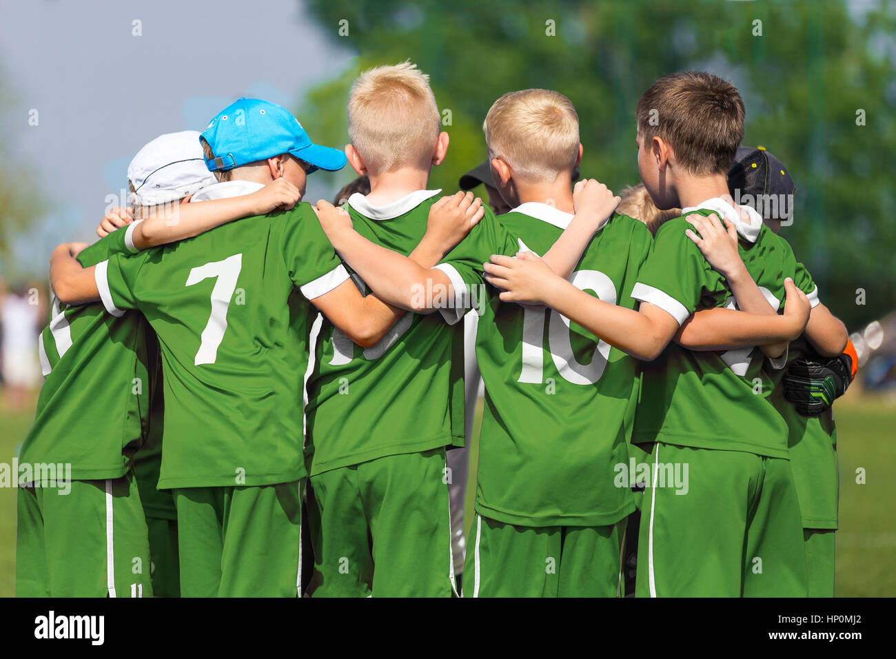 Kids Play Sports. Children Sports Team United Ready to Play Game. Children Team Sport. Youth Sports For Children. Boys in Sports Uniforms. Young Boys  Stock Photo