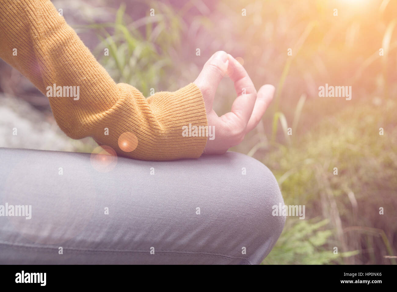 meditating woman fingers closeup Stock Photo