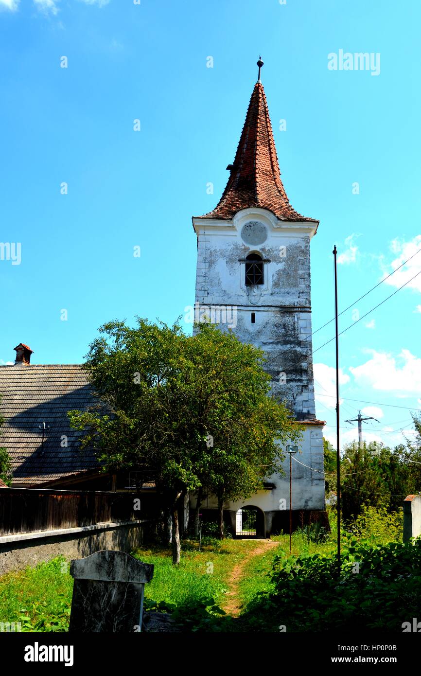 Tower of old saxon evangelic church in Halmeag. In Transylvania there ...