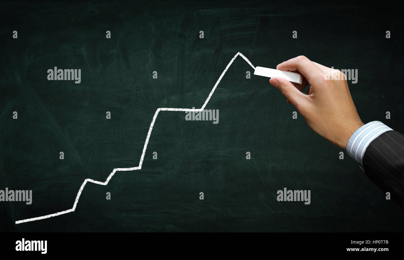 Hand of businessman drawing chart or growing arrow on chalkboard Stock ...
