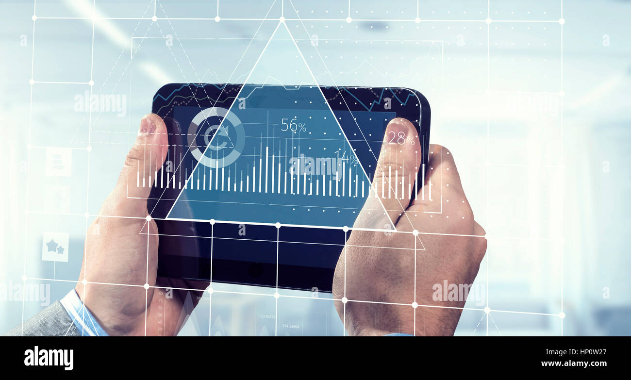 Close of businessman hands using tablet pc with infographs. Mixed media ...