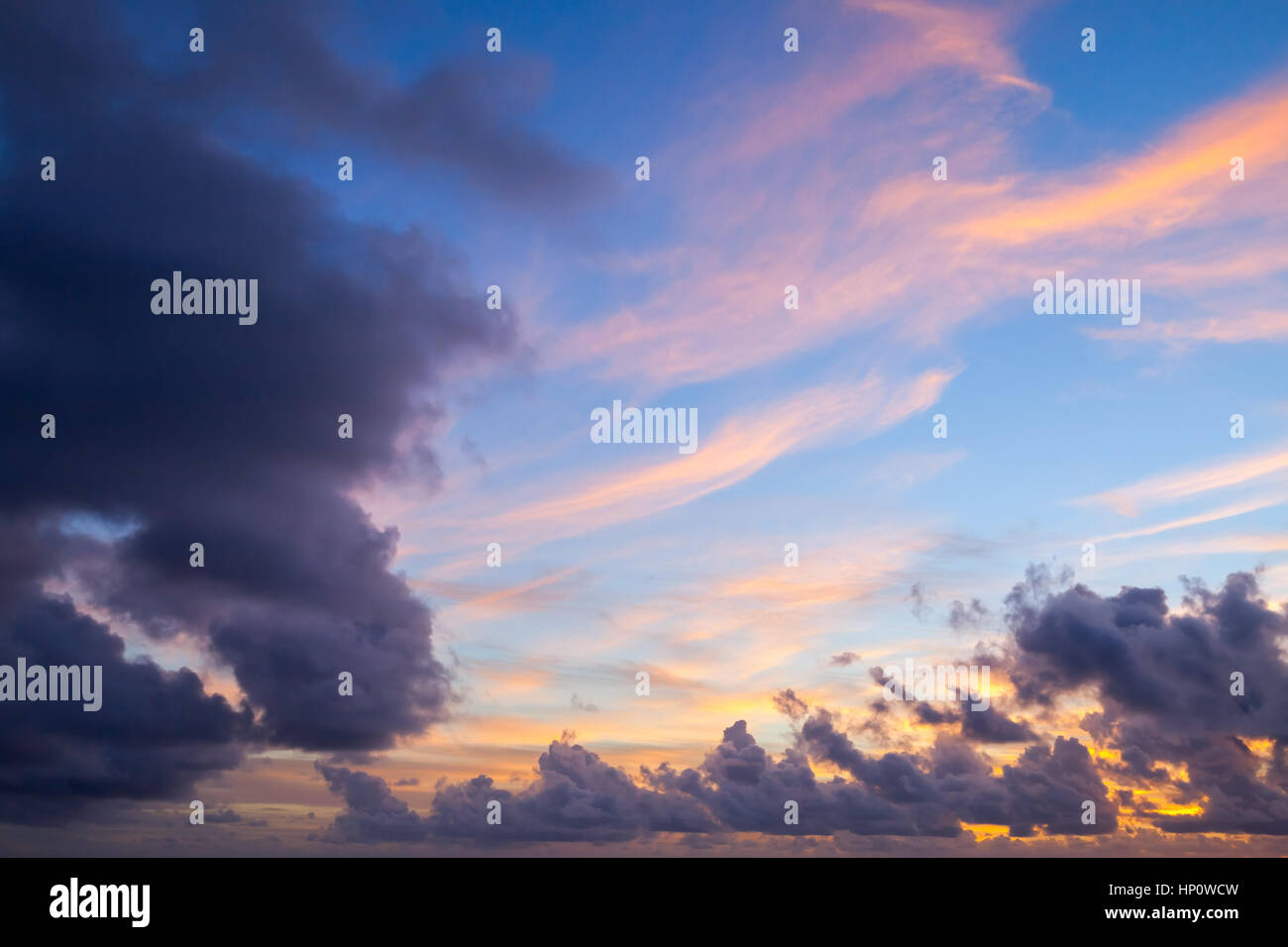 Colorful cloudy background photo with colorful tropical morning sky at sunrise Stock Photo