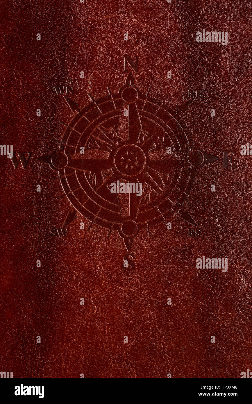 Vertical adventure leather cover with compass print macro stock photo