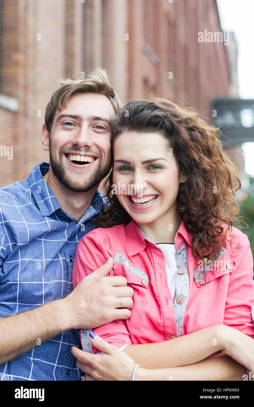 Affectionate couple smiling outdoors, portrait Stock Photo