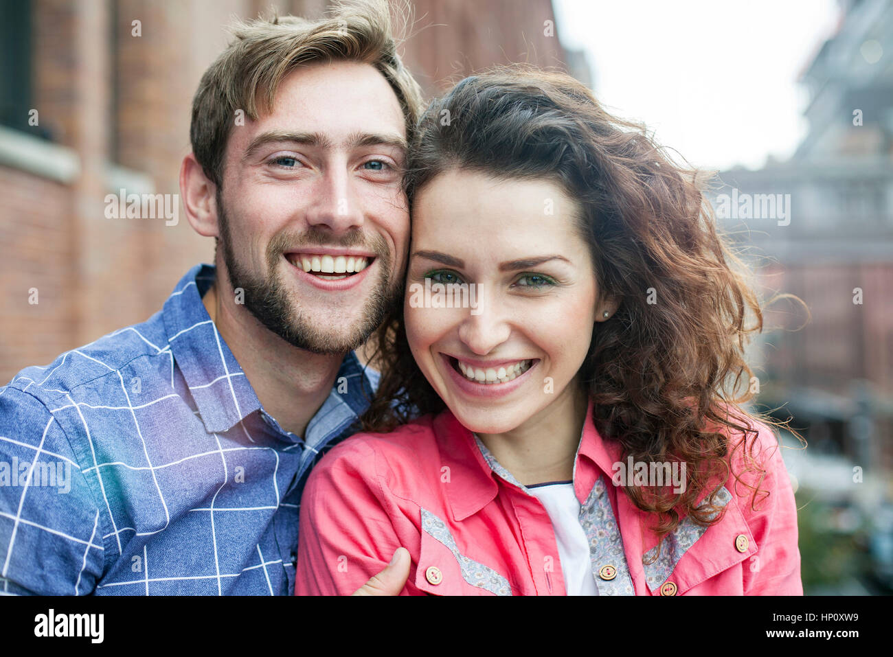 Couple smiling, cheek to cheek, portrait Stock Photo