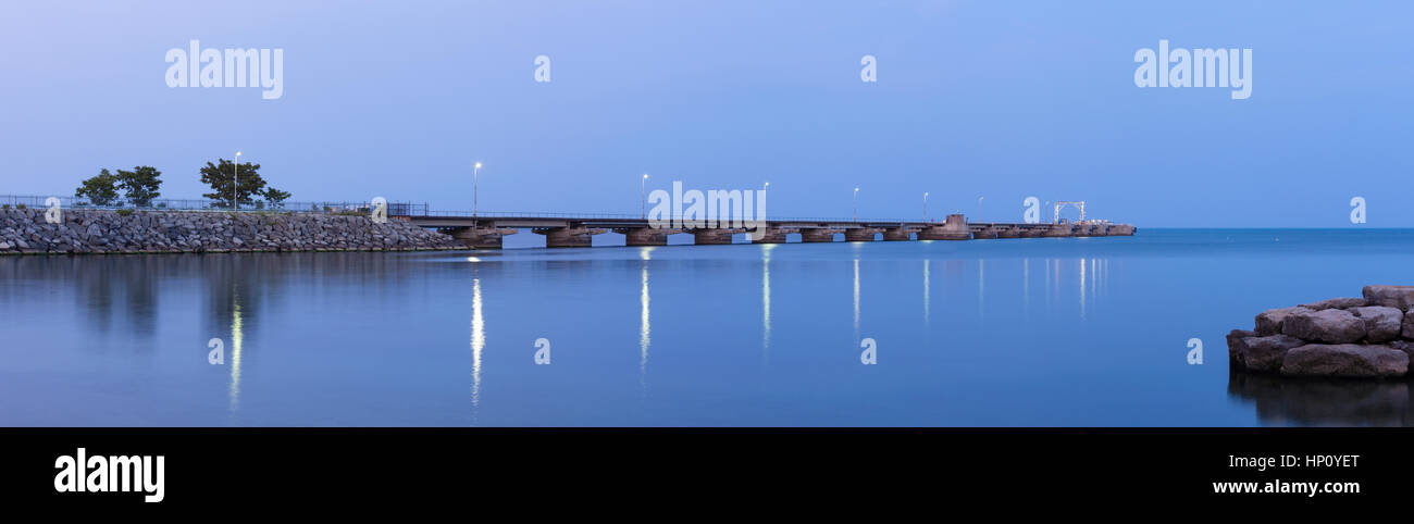 A panoramic shot of the Suncor Pier (Petro Canada Pier) at dusk in Oakville, Ontario, Canada. Stock Photo