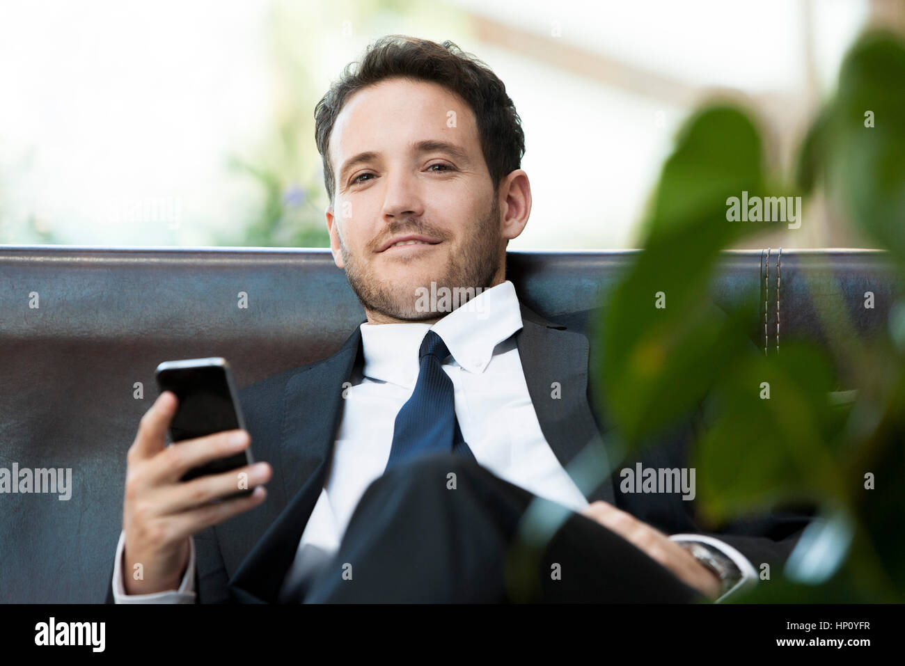 Business executive using smartphone Stock Photo