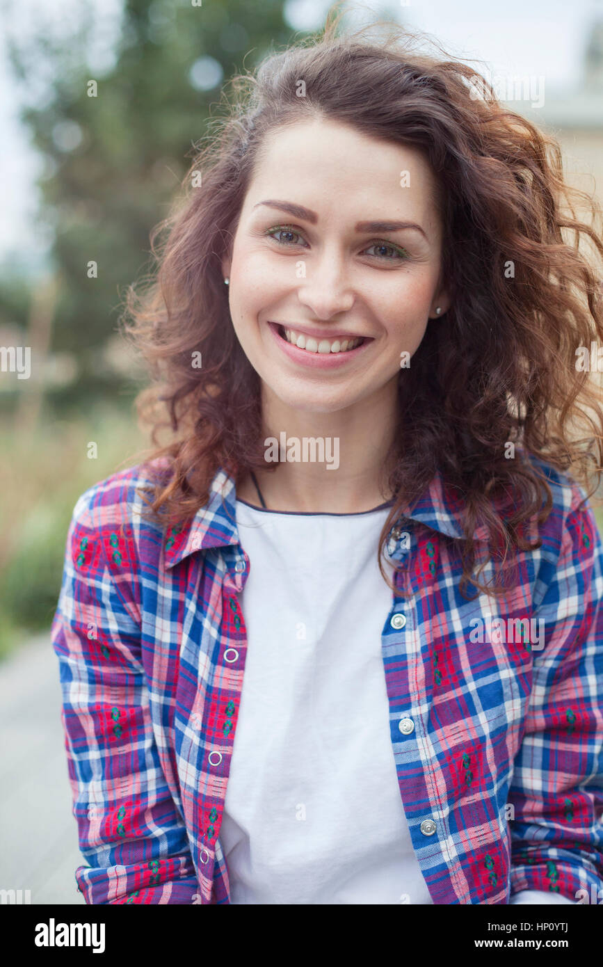 Young woman smiling cheerfully, portrait Stock Photo