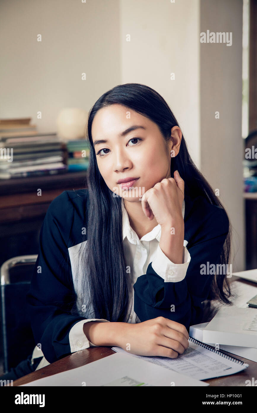 Woman leaning on elbows desk hi-res stock photography and images - Alamy