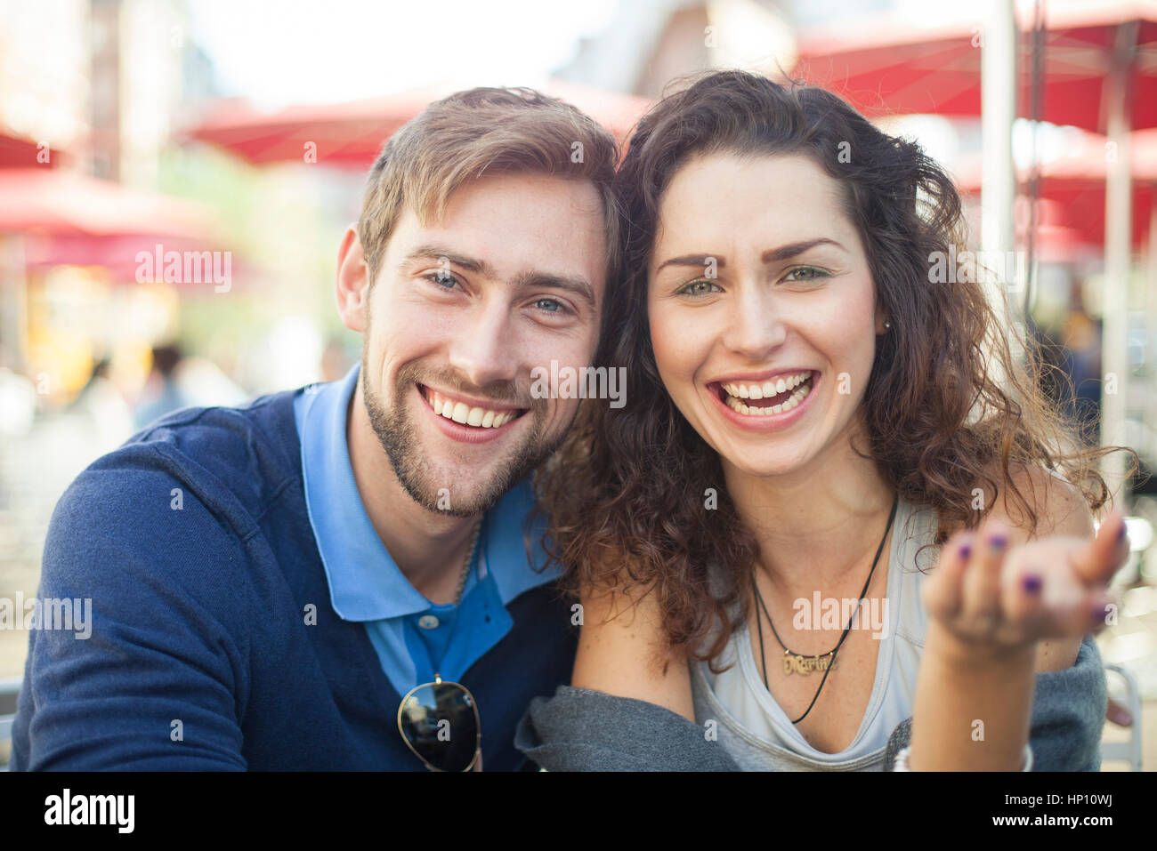 Young couple laughing together outdoors, portrait Stock Photo