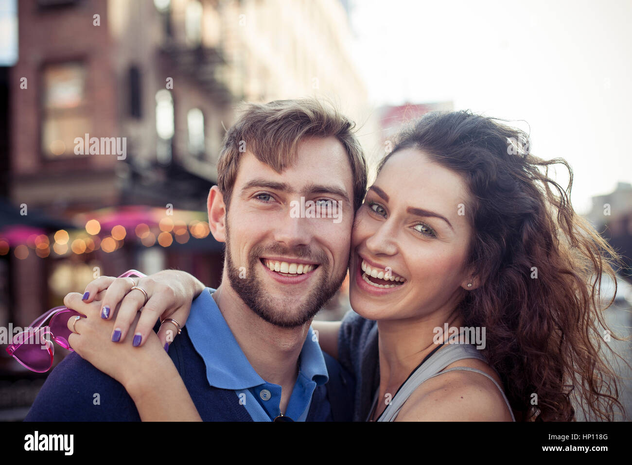 Couple embracing outdoors, portrait Stock Photo