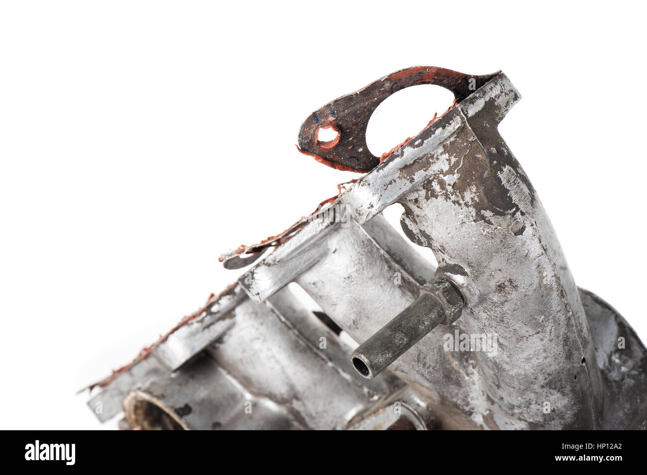 removing old gasket from intake manifolds holes Stock Photo Alamy