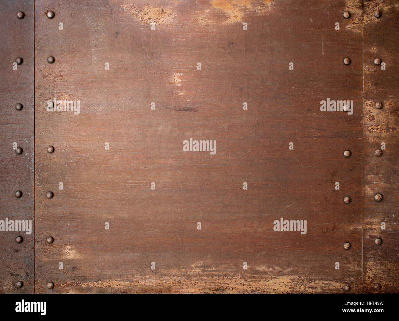 Rusty metal steam punk background or texture with rivets Stock Photo