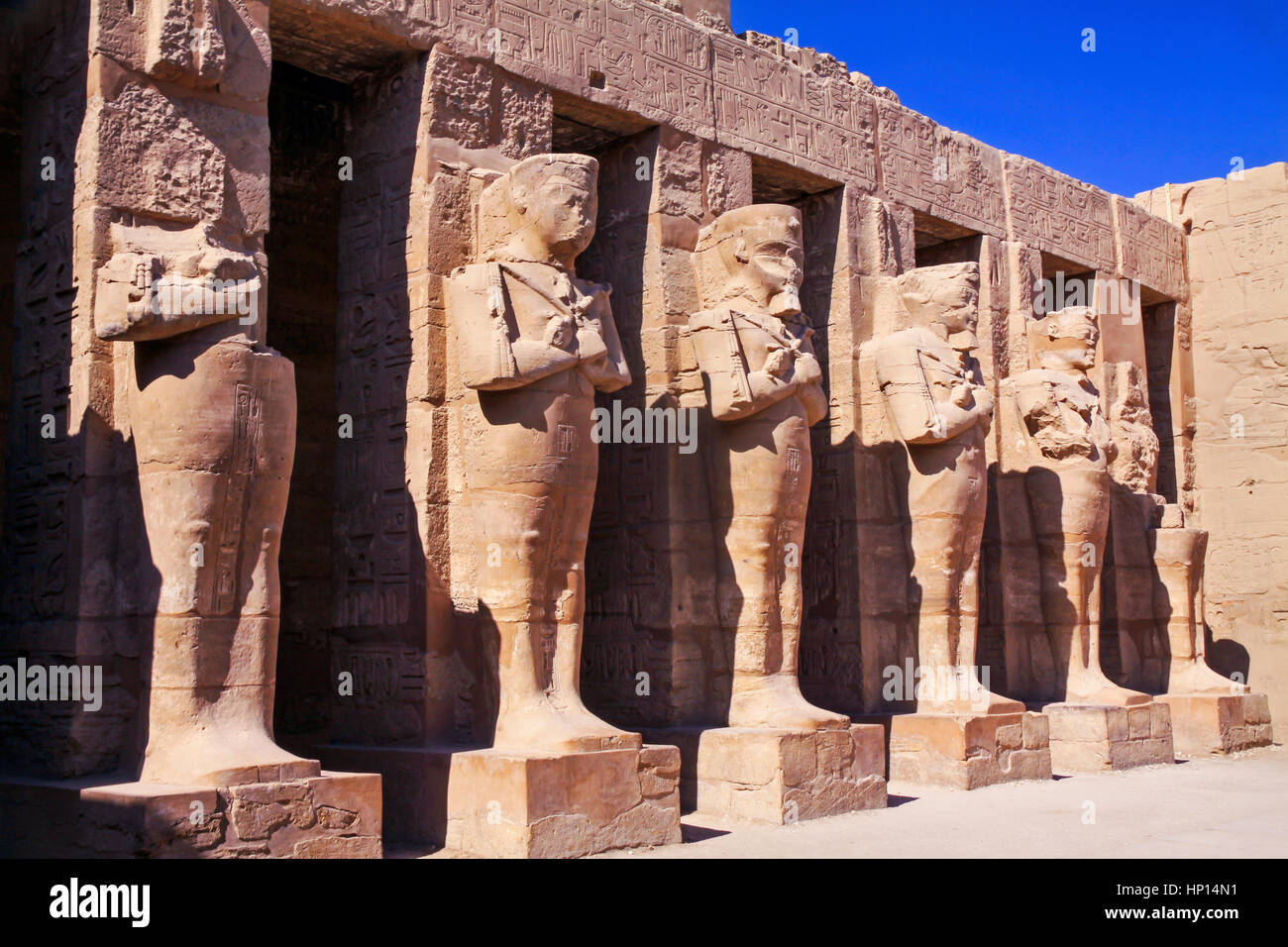 Ancient Egyptian Civilization Standing Statues in Karnak Temple Courtyard near Luxor Egypt Stock Photo