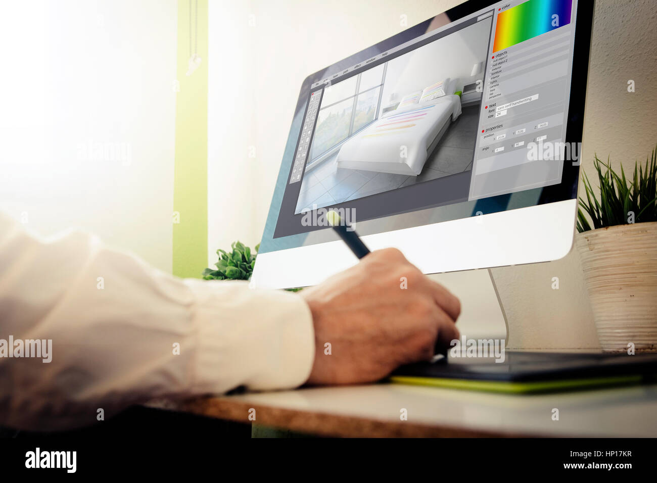 interior designer working with computer. All screen graphics are made ...