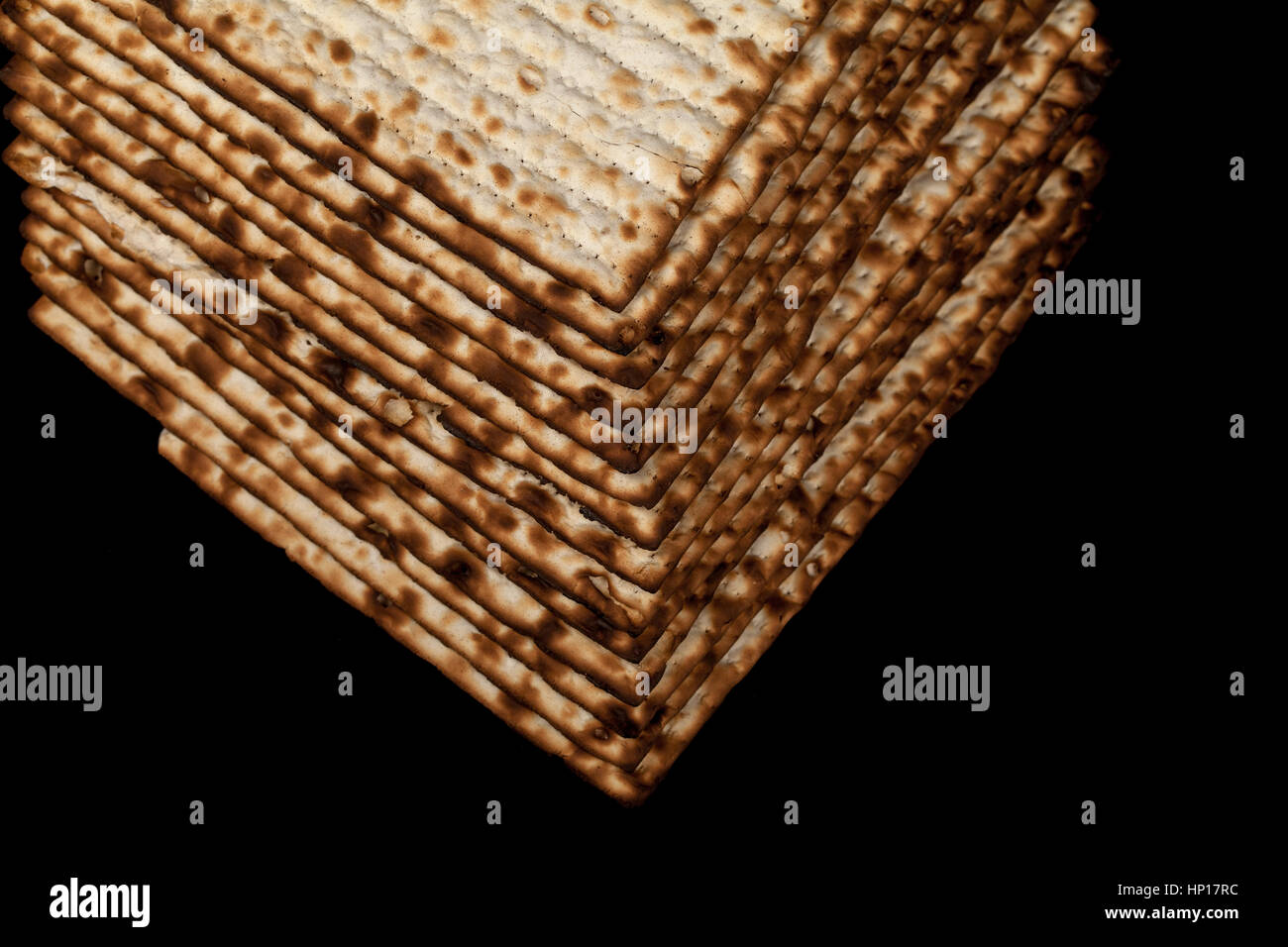 traditional-jewish-matzah-on-a-black-background-close-up-stock-photo