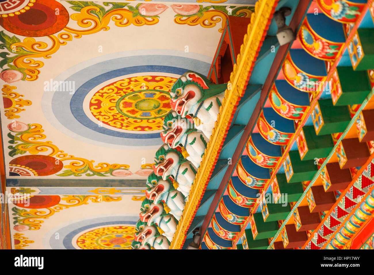 Brightly painted details at the Drigung Kagyud Lotus Stupa (German Temple), Lumbini, Nepal Stock Photo