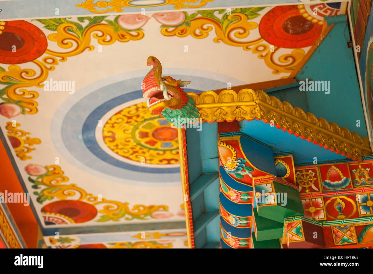 Brightly painted details at the Drigung Kagyud Lotus Stupa (German Temple), Lumbini, Nepal Stock Photo