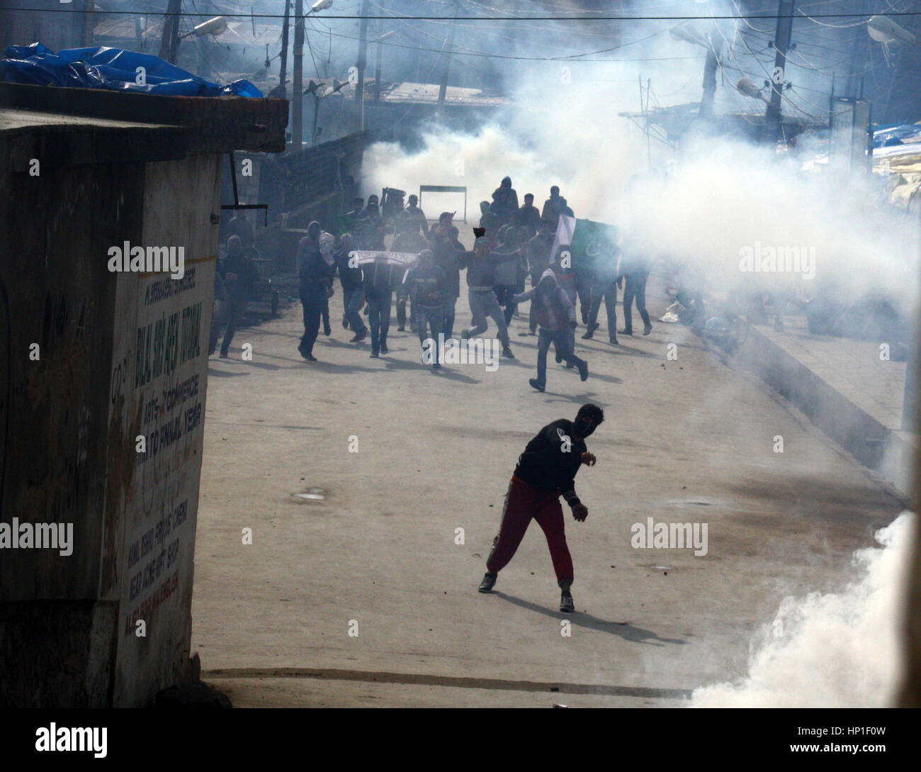 Srinagar, Indian Administered Kashmir. 17th February 2017.Masked protester hurled bricks (at unseen goverment forces ) during the protest at grand mosque after friday prayers .Expressing disappointment over the remarks of the Army Chief General Bipin Rawat.against civilians who indulge in stone pelting during counterinsurgency operations in Kashmir would be treated as anti-nationals and dealt with accordingly.Recently in Bandipora, stone-pelters attacked soldiers when they were about to launch an operation against terrorists holed up in a house. Credit: sofi suhail/Alamy Live News Stock Photo