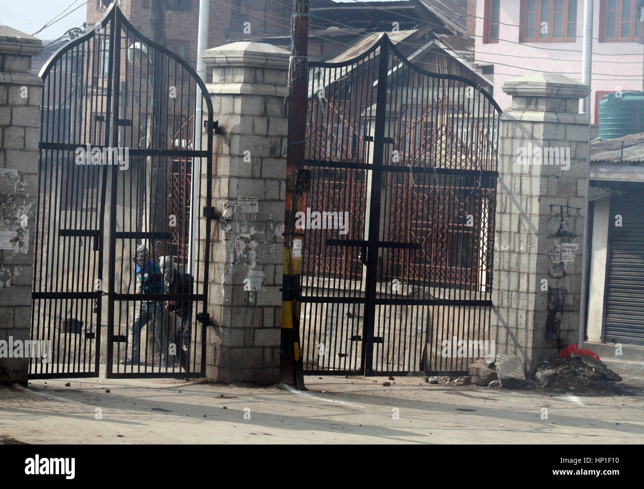 Srinagar, Indian Administered Kashmir. 17th February 2017.Masked protester hurled bricks (at unseen goverment forces ) during the protest at grand mosque after friday prayers .Expressing disappointment over the remarks of the Army Chief General Bipin Rawat.against civilians who indulge in stone pelting during counterinsurgency operations in Kashmir would be treated as anti-nationals and dealt with accordingly.Recently in Bandipora, stone-pelters attacked soldiers when they were about to launch an operation against terrorists holed up in a house. Credit: sofi suhail/Alamy Live News Stock Photo