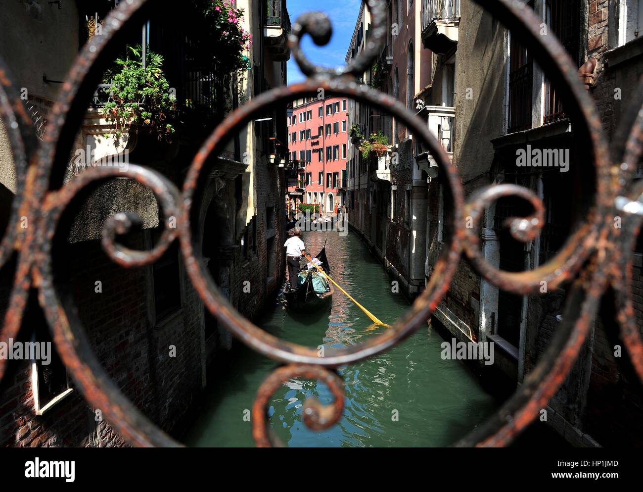 Tourists pass a canal on a gondola in Venice (Italy), photographed by ...