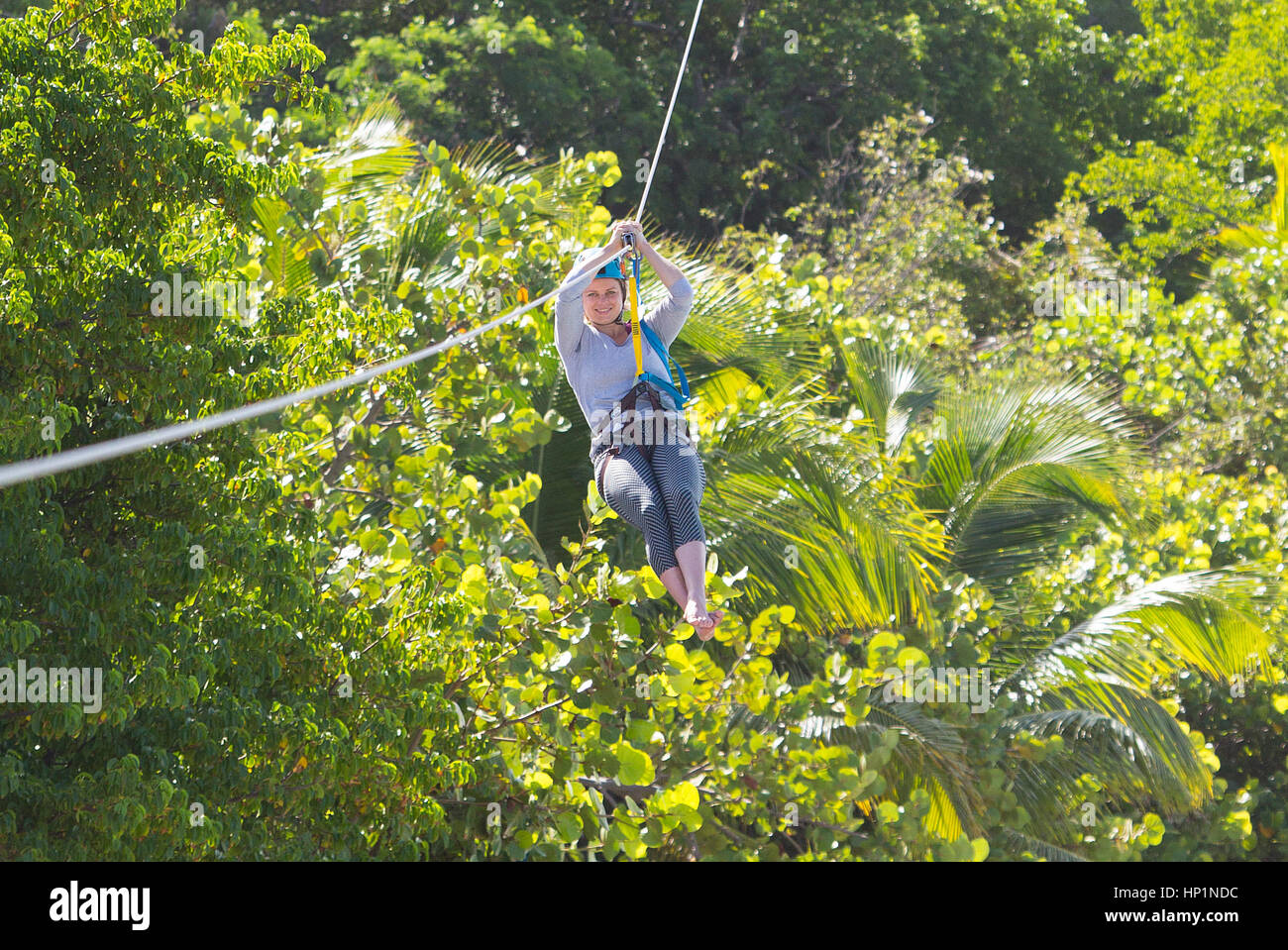 Neckar Island, Caribbean, British Virgin Islands. 17th Nov, 2014. Kim Clijsters zip lines over Necker Island. Credit: Mark Greenberg/ZUMA Wire/Alamy Live News Stock Photo