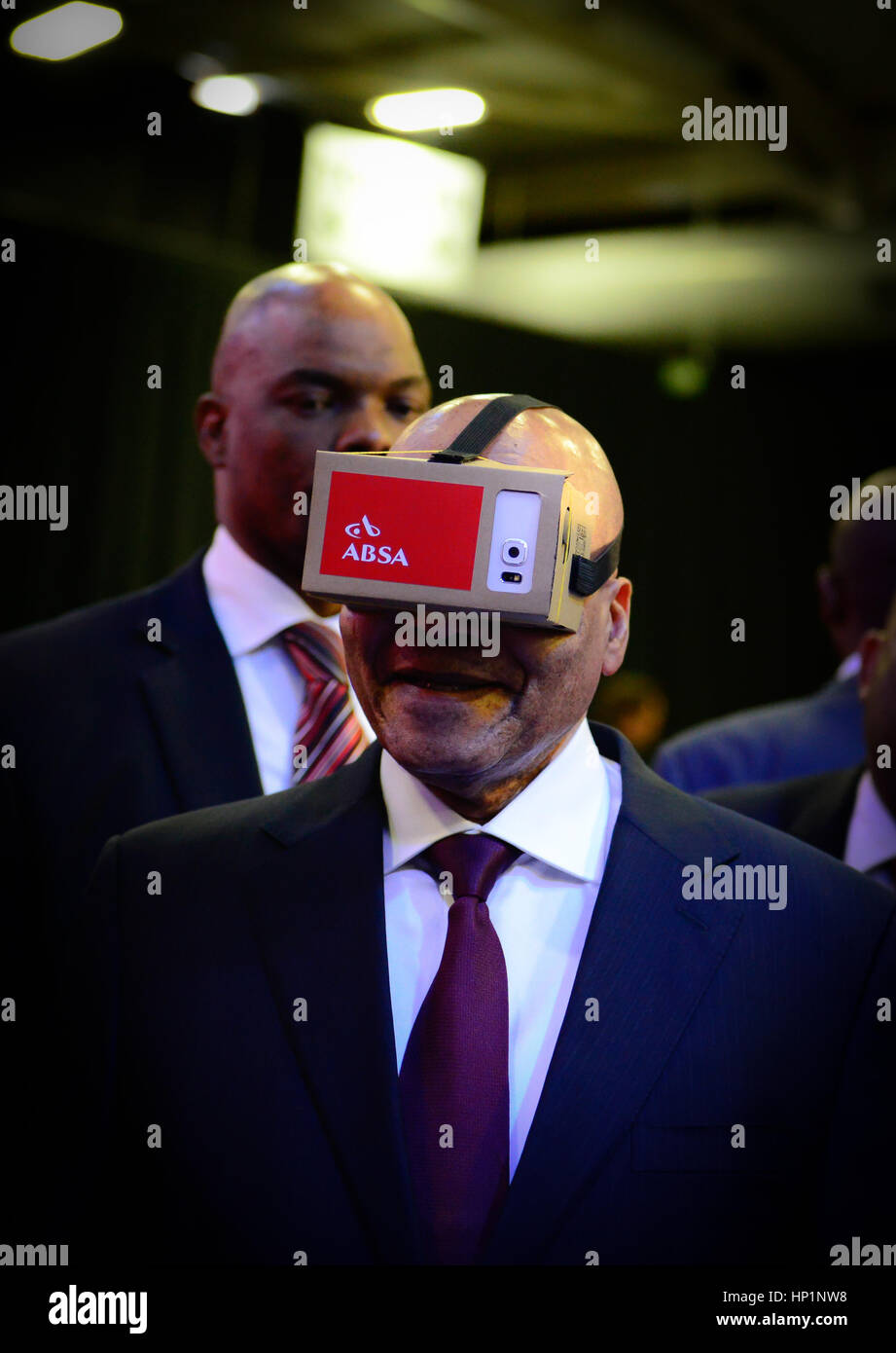 (170217) -- JOHANNESBURG, Feb. 17, 2017 (Xinhua) -- File photo taken on April 7, 2016 shows South African President Jacob Zuma tries a VR device provided by Amalgamated Banks of South Africa (ABSA) during the launch of the eChannel Pilot Project of the Department of Home Affairs at Gallagher Convention Center in Midrand, near Johannesburg,?South?Africa.?The South African government is prepared to act against market abuse, price-fixing and collusion in the private sector in order to protect the country's economy, President Jacob Zuma said on Feb. 16, 2017. Zuma was speaking after the Competitio Stock Photo