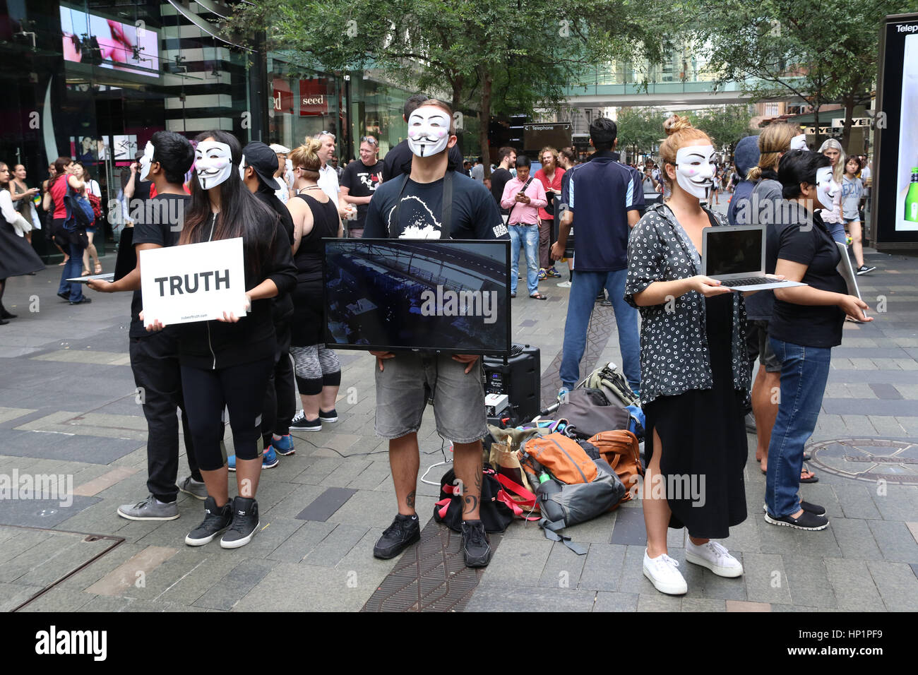 Sydney, Australia. 18 February 2017. ‘A group of Vegans held a silent protest in Pitt Street Mall, wearing anonymous ‘Guy Fawkes’ ‘ masks. Some held placards with the word ‘truth’ whilst others held screens appearing to show animal cruelty. Credit: © Richard Milnes/Alamy Live News Stock Photo